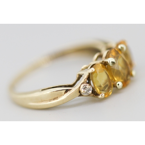 7 - Citrine Three Stone Ring with Diamond Inset to Shoulders Mounted in 9 Carat Yellow Gold Ring Size N ... 