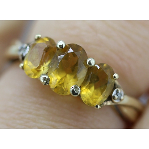 7 - Citrine Three Stone Ring with Diamond Inset to Shoulders Mounted in 9 Carat Yellow Gold Ring Size N ... 