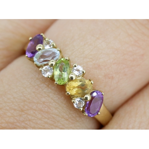 17 - Amethyst, Aquamarine, Peridot, Citrine and White Topaz Set Cluster Band Ring Mounted in 9 Carat Yell... 