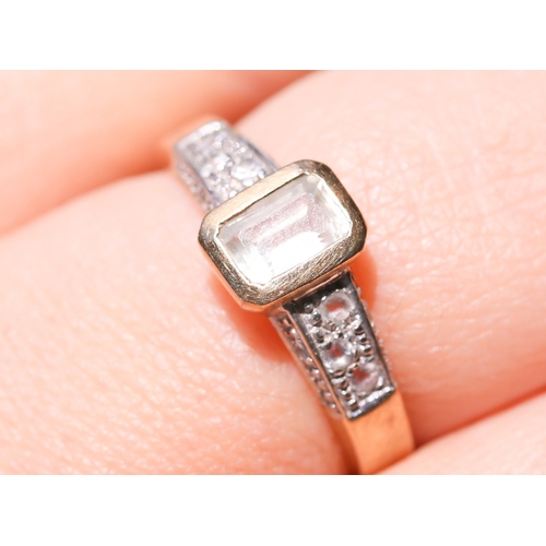 5 - Emerald Cut Aquamarine Bezel Set Ring with Further Gemstones Set to Shoulders Mounted in 9 Carat Yel... 