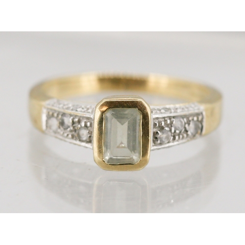 5 - Emerald Cut Aquamarine Bezel Set Ring with Further Gemstones Set to Shoulders Mounted in 9 Carat Yel... 