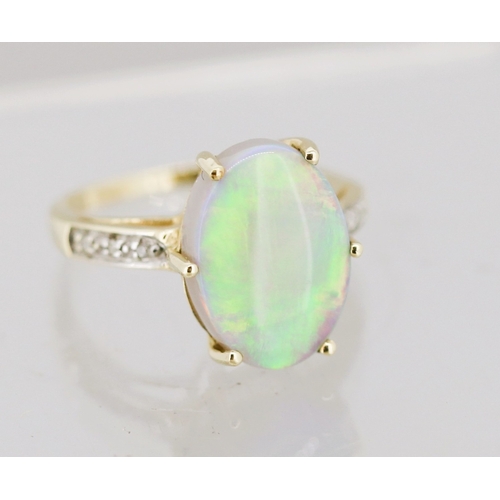 53 - Opal Set Ring with Further Diamond Inset to Shoulders Mounted in 9 Carat Yellow Gold Ring Size K