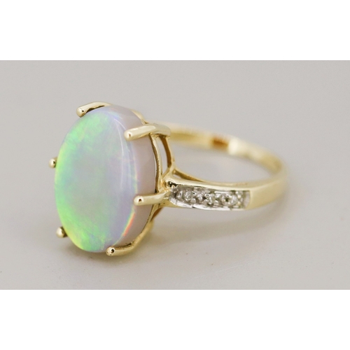 53 - Opal Set Ring with Further Diamond Inset to Shoulders Mounted in 9 Carat Yellow Gold Ring Size K