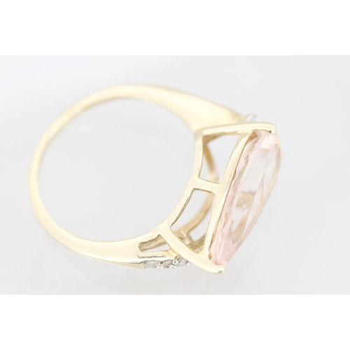 57 - Pear Cut Morganite Set Ring with Diamond Set Surround Mounted in 9 Carat Yellow Gold Ring Size L