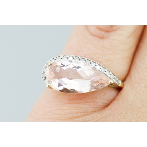 57 - Pear Cut Morganite Set Ring with Diamond Set Surround Mounted in 9 Carat Yellow Gold Ring Size L