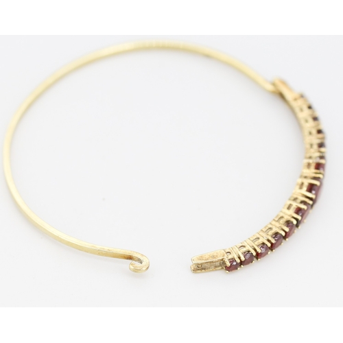 59 - Red Garnet Thirteen Stone Graduated Form Set Bangle Bracelet Mounted in 9 Carat Yellow Gold Inner Wi... 