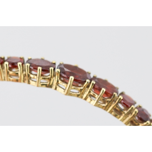 59 - Red Garnet Thirteen Stone Graduated Form Set Bangle Bracelet Mounted in 9 Carat Yellow Gold Inner Wi... 