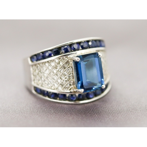 18 - Attractively Detailed Blue Tourmaline Set Ring with Diamond Cluster Set Surround, Further Set with S... 