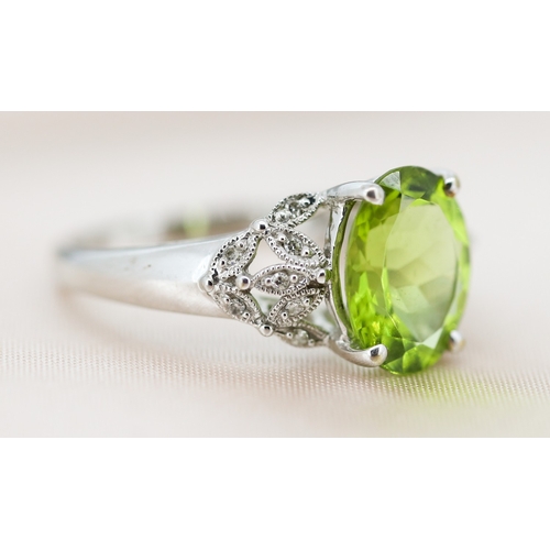 2 - Finely Detailed Peridot Set Ring with Diamond Cluster Set Shoulders, Mounted in 9 Carat White Gold, ... 