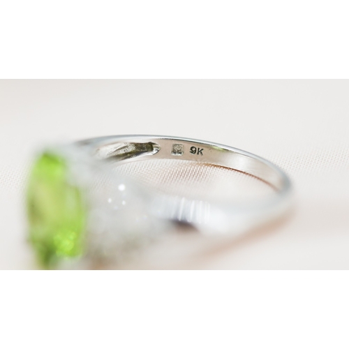 2 - Finely Detailed Peridot Set Ring with Diamond Cluster Set Shoulders, Mounted in 9 Carat White Gold, ... 