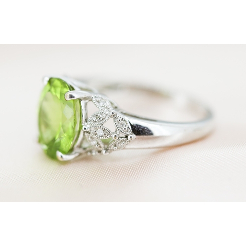2 - Finely Detailed Peridot Set Ring with Diamond Cluster Set Shoulders, Mounted in 9 Carat White Gold, ... 