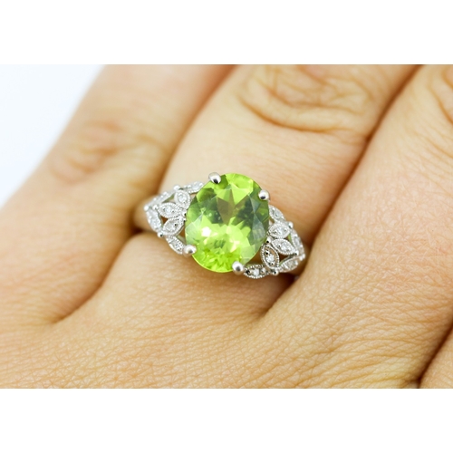 2 - Finely Detailed Peridot Set Ring with Diamond Cluster Set Shoulders, Mounted in 9 Carat White Gold, ... 