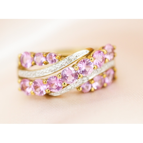 29 - Finely Detailed, Pink Sapphire and Diamond Set Crossover Form Ring, Mounted in 9 Carat Yellow Gold, ... 