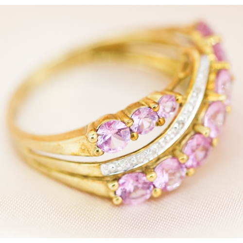 29 - Finely Detailed, Pink Sapphire and Diamond Set Crossover Form Ring, Mounted in 9 Carat Yellow Gold, ... 