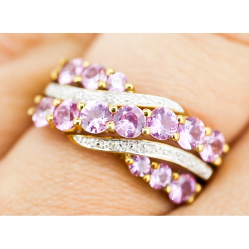 29 - Finely Detailed, Pink Sapphire and Diamond Set Crossover Form Ring, Mounted in 9 Carat Yellow Gold, ... 