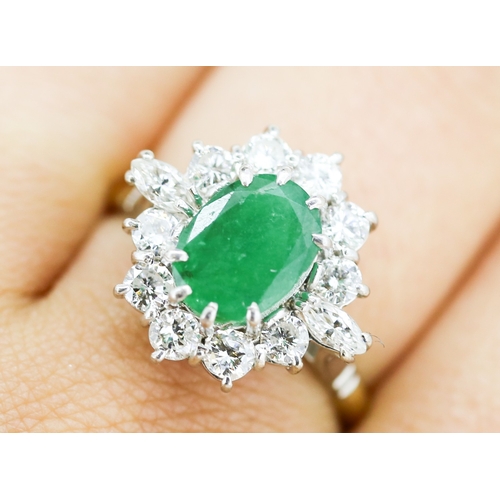 36 - Finely Detailed, Emerald Centre Stone Ring with Ten Round Cut Diamond Set Halo and Further Marquise ... 