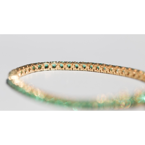 53 - Emerald Fifty-Six Stone Set Tennis Bracelet, Mounted in 18 Carat Yellow Gold, Total Emerald Carat We... 