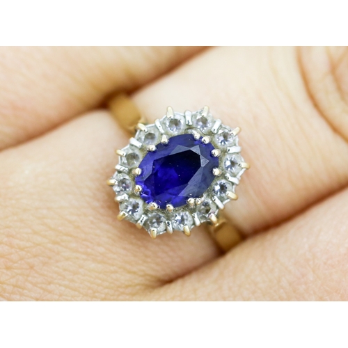6 - Sapphire Set Ring with Cubic Zirconia Set Halo Surround, Mounted in 14 Carat Yellow Gold, Ring Size ... 