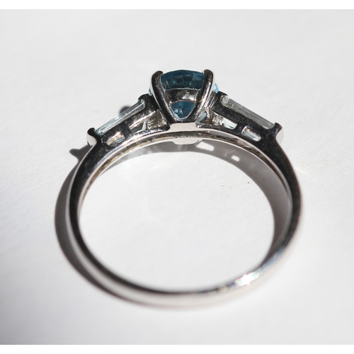 15 - Blue Topaz Set Ring with Tapered Baguette Cut Aquamarine Set to Shoulders, Mounted in 9 Carat White ... 