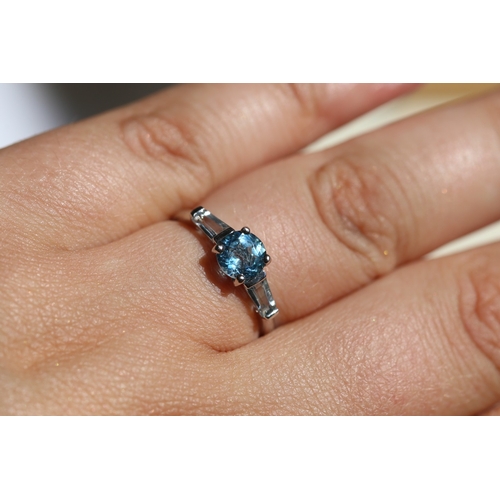 15 - Blue Topaz Set Ring with Tapered Baguette Cut Aquamarine Set to Shoulders, Mounted in 9 Carat White ... 