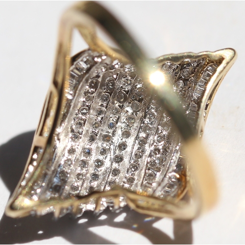 16 - Finely Detailed Round Cut and Tapered Baguette Cut Diamond Set Cluster Ring, Mounted in 9 Carat Yell... 