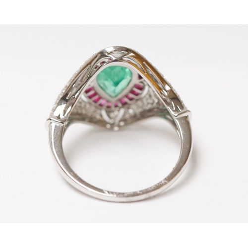 24 - Attractively Detailed Pear Cut Emerald Set Centre Stone Ring with Finely Set Ruby and Diamond Cluste... 