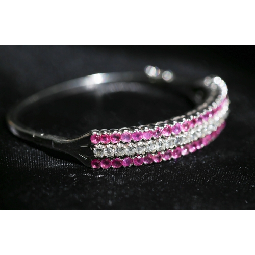 29 - Attractively Detailed, Ruby and Diamond Three Row Set Cluster Form Bangle Bracelet, Mounted in 18 Ca... 