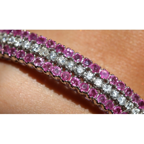 29 - Attractively Detailed, Ruby and Diamond Three Row Set Cluster Form Bangle Bracelet, Mounted in 18 Ca... 