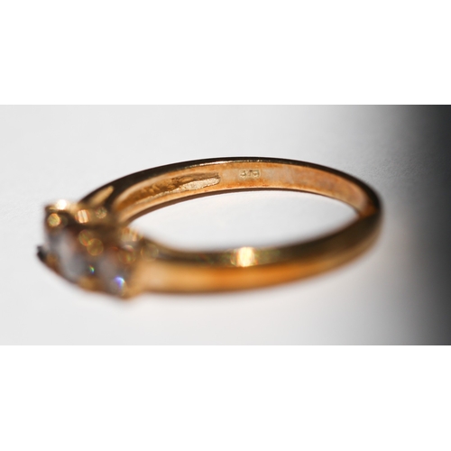 36 - Cognac Diamond Three Stone Ring, Mounted in 9 Carat Yellow Gold, Ring Size N
