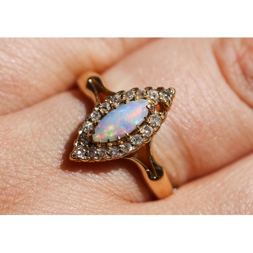 5 - Marquise Form Opal Set Ring with Diamond Set Surround, Mounted in 18 Carat Yellow Gold, Ring Size P ... 