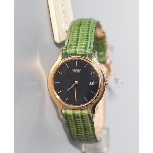 12 - Seiko Unisex Gold Tone Wristwatch, Date Aperture Green Leather Strap As New Shop Tag Present