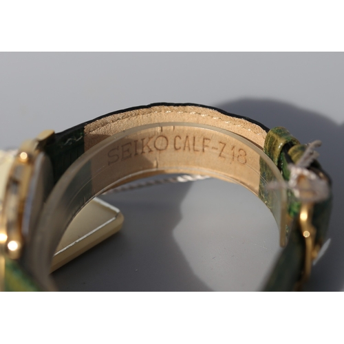 12 - Seiko Unisex Gold Tone Wristwatch, Date Aperture Green Leather Strap As New Shop Tag Present
