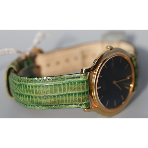 12 - Seiko Unisex Gold Tone Wristwatch, Date Aperture Green Leather Strap As New Shop Tag Present