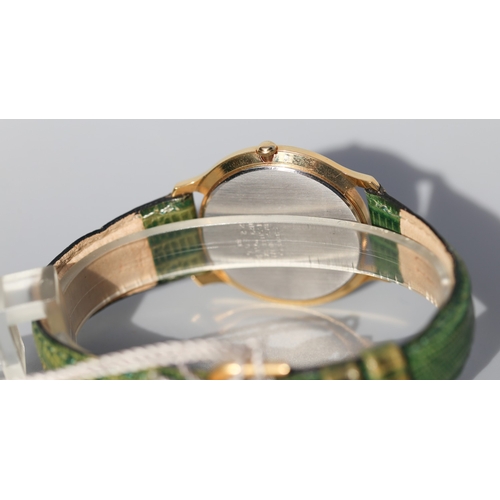 12 - Seiko Unisex Gold Tone Wristwatch, Date Aperture Green Leather Strap As New Shop Tag Present