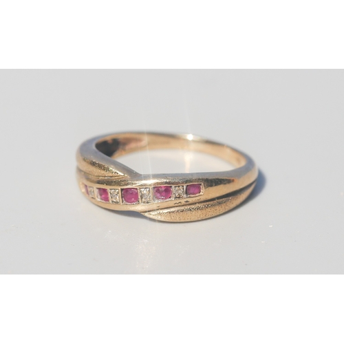16 - Ruby and Diamond Set Crossover Form Ring, Mounted in 9 Carat Yellow Gold, Ring Size P