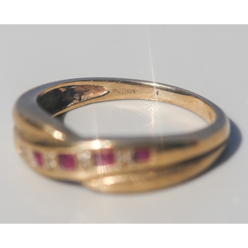 16 - Ruby and Diamond Set Crossover Form Ring, Mounted in 9 Carat Yellow Gold, Ring Size P