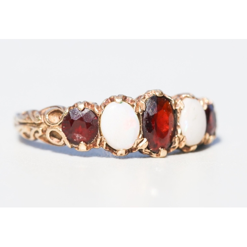 18 - Attractively Detailed, Garnet and Opal Set Five Stone Graduated Form Ring, Mounted in 9 Carat Yellow... 