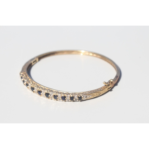 23 - Finely Detailed, Eleven Stone Sapphire Set Bangle Bracelet with Diamond Insets, Incised Detail to Si... 