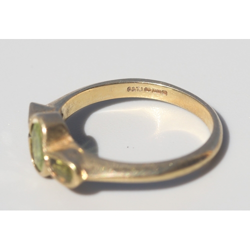 24 - Bezel Set Peridot Three Stone Ring, Mounted in 9 Carat Yellow Gold, Ring Size O and a Half