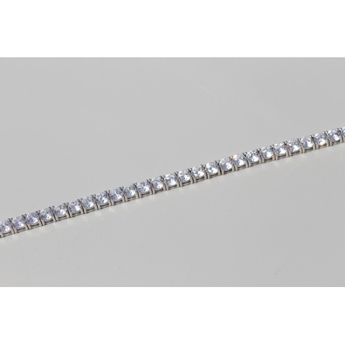 28 - Cubic Zirconia Set Tennis Bracelet, Mounted in 9 Carat White Gold, 18.5cm Long with Safety Clasps