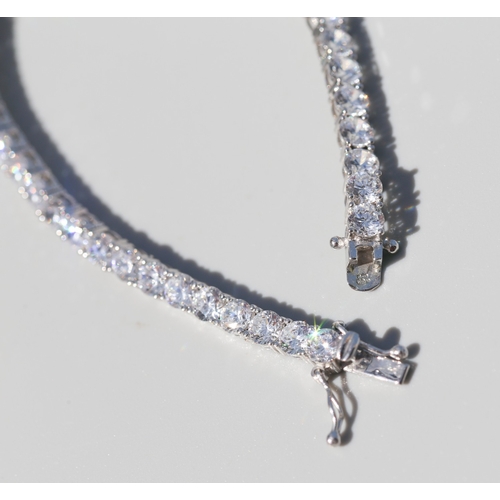 28 - Cubic Zirconia Set Tennis Bracelet, Mounted in 9 Carat White Gold, 18.5cm Long with Safety Clasps