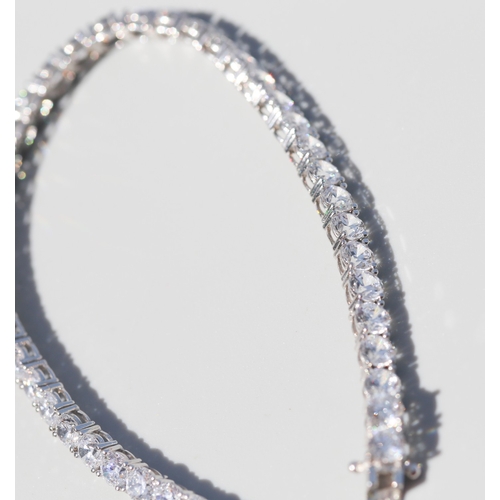 28 - Cubic Zirconia Set Tennis Bracelet, Mounted in 9 Carat White Gold, 18.5cm Long with Safety Clasps