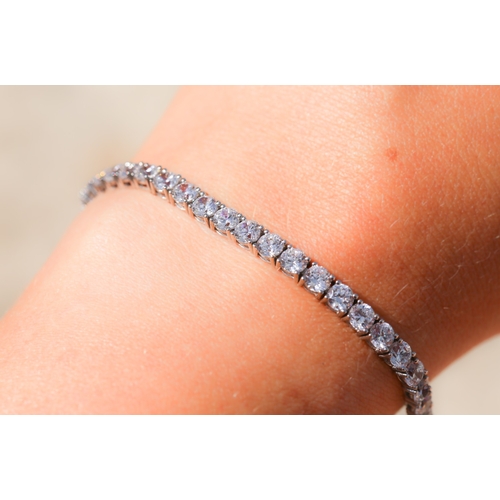 28 - Cubic Zirconia Set Tennis Bracelet, Mounted in 9 Carat White Gold, 18.5cm Long with Safety Clasps