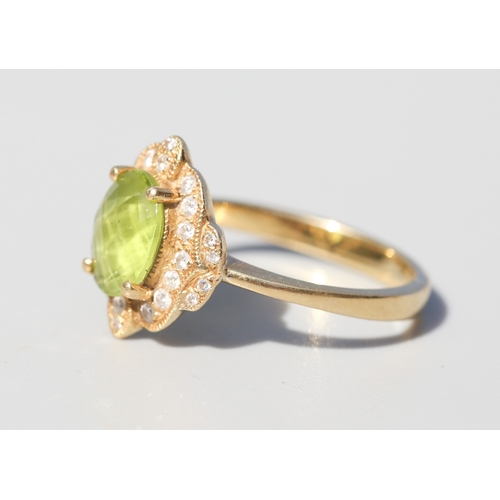 30 - Finely Detailed, Facet Cut Peridot Set Centre Stone Ring with Diamond Cluster Set Surround, Mounted ... 