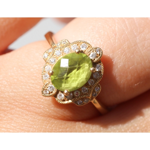 30 - Finely Detailed, Facet Cut Peridot Set Centre Stone Ring with Diamond Cluster Set Surround, Mounted ... 