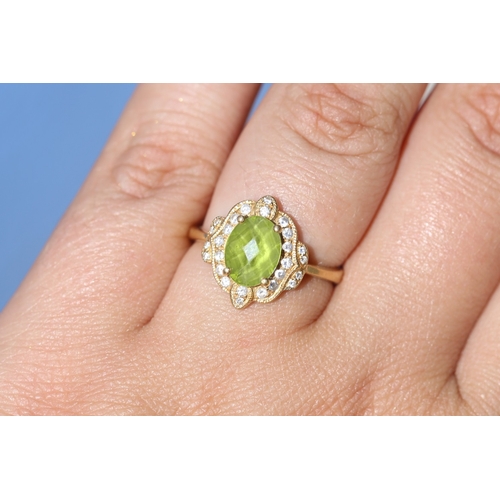 30 - Finely Detailed, Facet Cut Peridot Set Centre Stone Ring with Diamond Cluster Set Surround, Mounted ... 