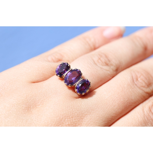 33 - Attractively Detailed, Amethyst Three Stone Basket Set Ring, Mounted in 9 Carat Yellow Gold, Ring Si... 