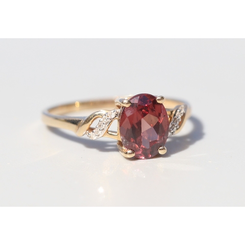 36 - Attractively Detailed, Rhodolite Tourmaline Set Ring with Diamond Inset Ribbon Motif Shoulders, Moun... 