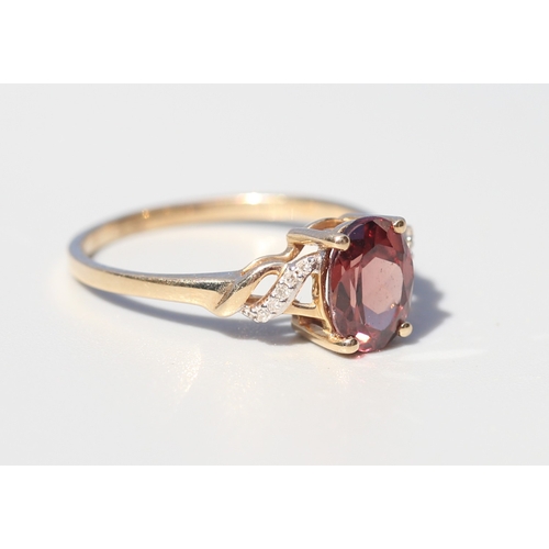 36 - Attractively Detailed, Rhodolite Tourmaline Set Ring with Diamond Inset Ribbon Motif Shoulders, Moun... 