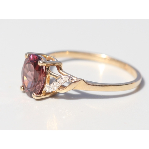 36 - Attractively Detailed, Rhodolite Tourmaline Set Ring with Diamond Inset Ribbon Motif Shoulders, Moun... 